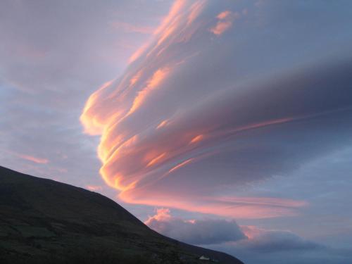 a cloud formation in the sky over a hill at Tigh Cladach in Cahersiveen