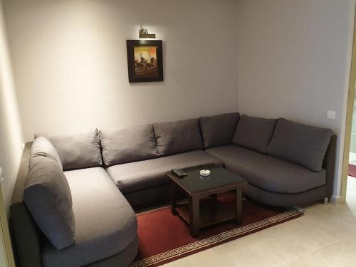 a living room with a couch and a table at Residence Davos Rabat in Rabat