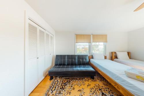a living room with two beds and a couch at Beaches n' Sunsets in Eastham