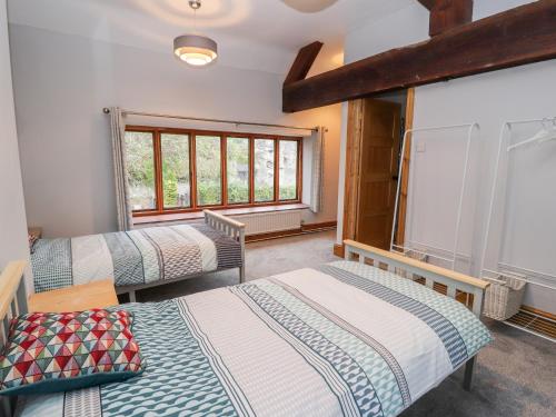 Postel nebo postele na pokoji v ubytování Abbey Cottage