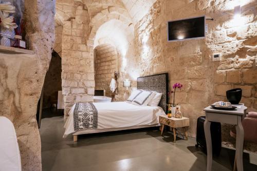 Postel nebo postele na pokoji v ubytování 19.52 Matera