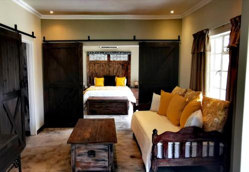 Ένα ή περισσότερα κρεβάτια σε δωμάτιο στο River Rock Lodge