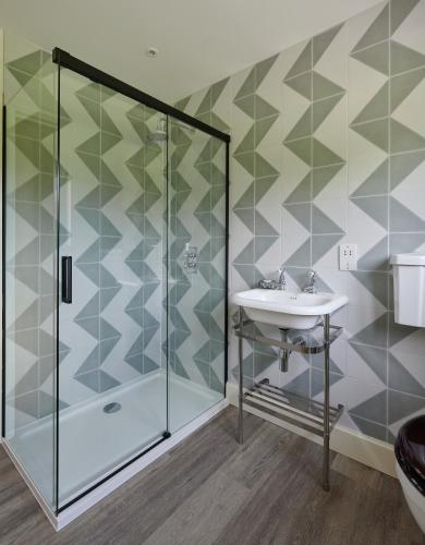 a bathroom with a shower and a sink at The Cabin in Haverfordwest