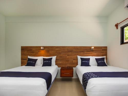 מיטה או מיטות בחדר ב-Hotel Pejelagarto