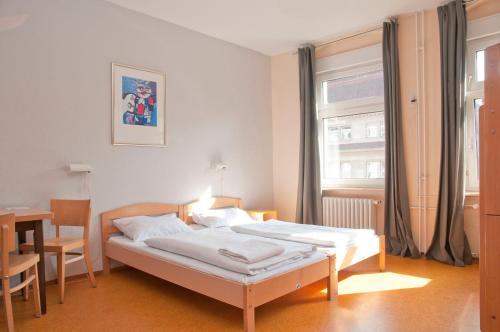 Postel nebo postele na pokoji v ubytování Happy Hotel Berlin
