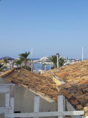 a damaged roof of a building at Casa Quimeres in Denia