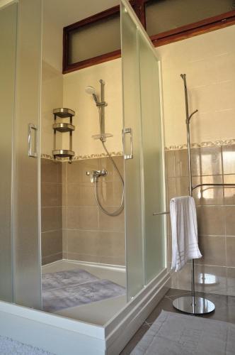 a shower with a glass door in a bathroom at Paril in Crikvenica