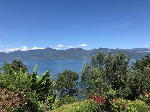 a view of a lake with mountains in the background at Villas de Atitlan in Cerro de Oro