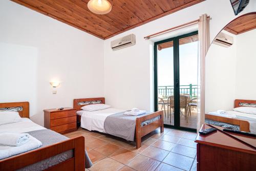 A bed or beds in a room at Neriides Villas