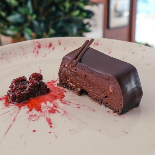 a piece of chocolate cake on a plate at Grey Family Hotel in Kopaonik