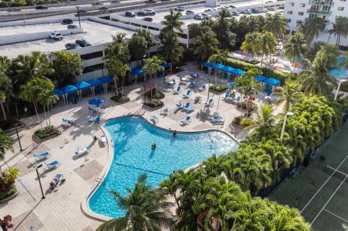an overhead view of a pool at a resort at Sunny Isles Ocean Reserve Condo Apartments in Miami Beach