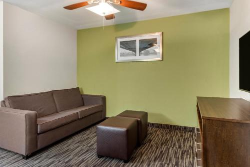 a living room with a couch and a table at Comfort Inn & Suites North Little Rock JFK Blvd in North Little Rock