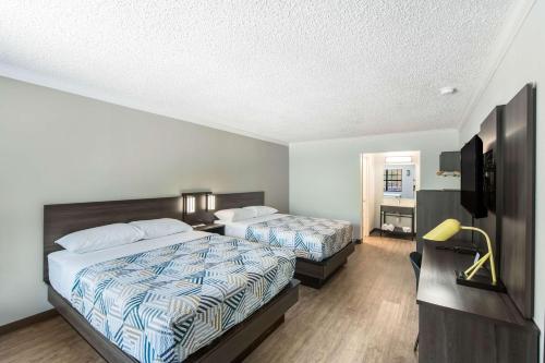 Postel nebo postele na pokoji v ubytování Motel 6-Kilgore, TX
