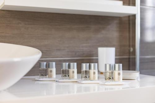 a white counter with several small candles on it at GIGANTES Oasis Deluxe by Sunkeyrents in Santiago del Teide