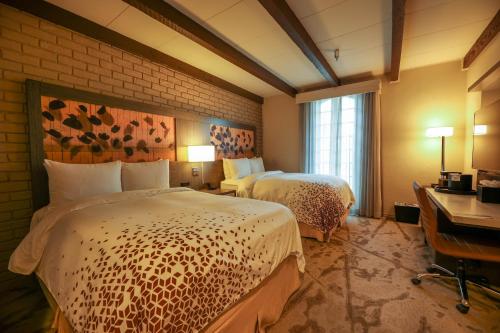 Ένα ή περισσότερα κρεβάτια σε δωμάτιο στο Casa De Palmas, Trademark Collection by Wyndham