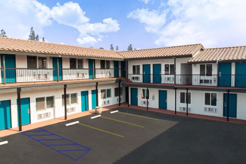arial view of an apartment complex with a parking lot at Magnolia Tree Hotel-Maingate/Anaheim Convention Center in Anaheim