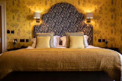 A bed or beds in a room at South Causey Inn 