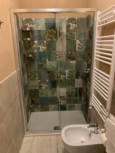 a bathroom with a shower and a sink at Locanda il Deserto in Livorno