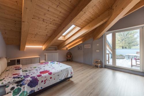 Postel nebo postele na pokoji v ubytování Loft 29 mansardato con ampio terrazzo