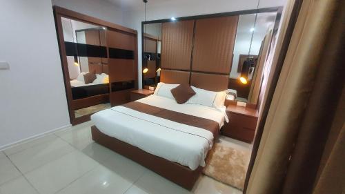 Un pat sau paturi într-o cameră la Indico Apart Hotel