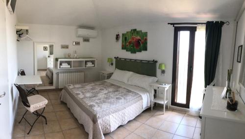 Кровать или кровати в номере Il Grano Di Bramante