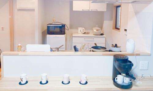 a kitchen with a counter top with a mixer at 浅草圈4层独栋别墅 免费停车场 近车站 可直达机场 in Tokyo