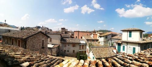 a view of a town with roofs at Cantina Dell'Arte in Ascoli Piceno