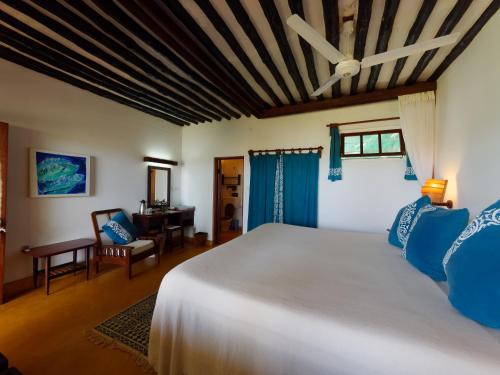 A bed or beds in a room at Peponi Hotel Lamu - Kenya