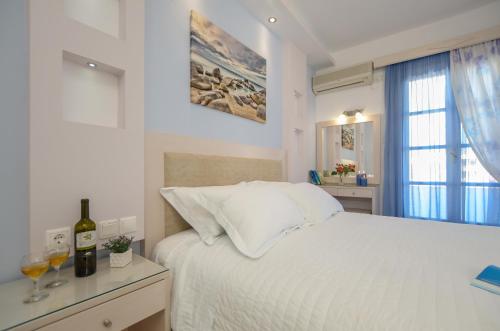 Postel nebo postele na pokoji v ubytování Ilion Hotel