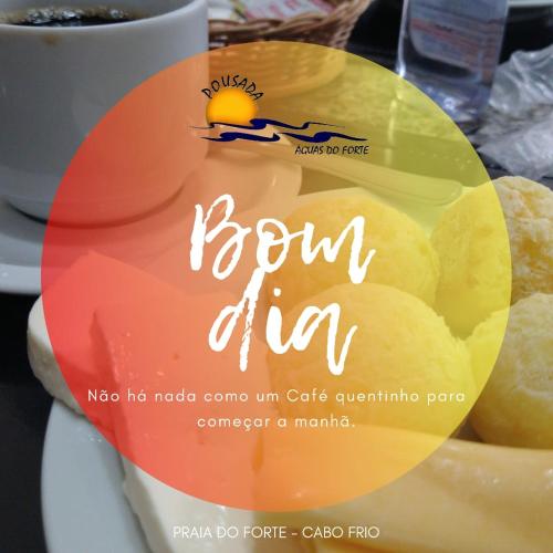a sign on a plate with a piece of cheese at Pousada Águas do Forte in Cabo Frio