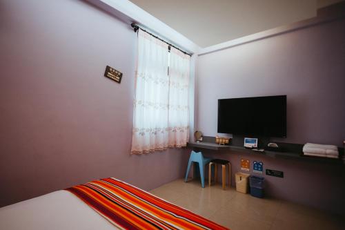 Μια τηλεόραση ή/και κέντρο ψυχαγωγίας στο Pingan Ju Homestay