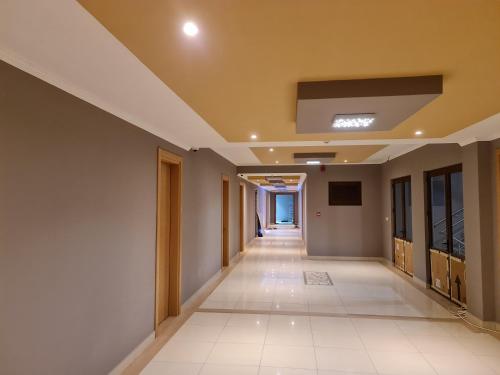 an empty hallway in a building with a ceiling at Royale Suites by Arc Royal Luxury Apts in Anse Royale