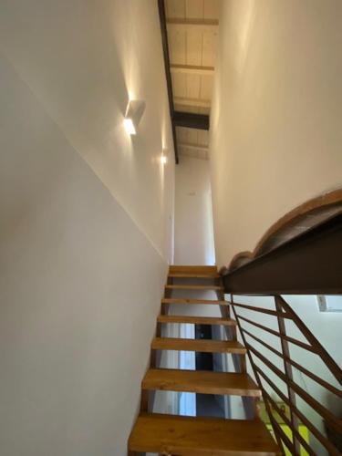 a staircase in a building with a stair case at La Magnolia in Greve in Chianti