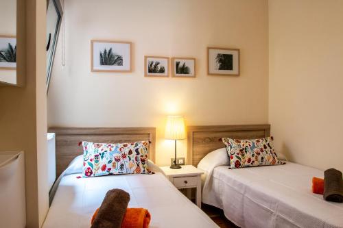 Un ou plusieurs lits dans un hébergement de l'établissement Le Poulpe bleu Fuerteventura chic and relax