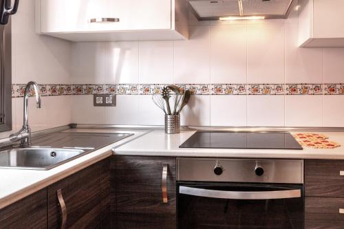 a kitchen with a sink and a stove at Le Poulpe bleu Fuerteventura chic and relax in Puerto del Rosario