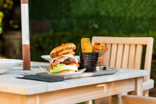 a tray with a sandwich and french fries on a table at Holiday Inn Newcastle-Jesmond by IHG in Newcastle upon Tyne