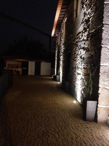 an empty hallway of a building at night at Casa do Engenho Braga - Apartamentos com Vista Rio & SPA in Braga