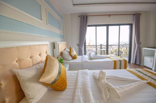 Ένα ή περισσότερα κρεβάτια σε δωμάτιο στο Hak Huot Hotel I