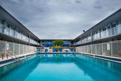 a swimming pool in the middle of a building at Days Inn by Wyndham Stuart in Stuart