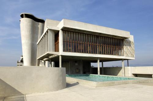a building with a swimming pool in front of it at Hotel le Corbusier in Marseille