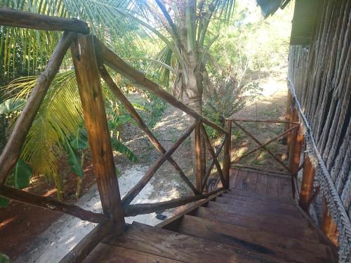 a wooden stairway leading up to a house at COCO REEF ECOLODGE in Kizimkazi
