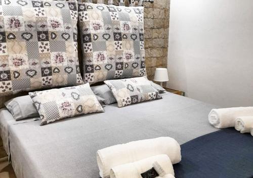 מיטה או מיטות בחדר ב-O'Paisi Casa Vacanze