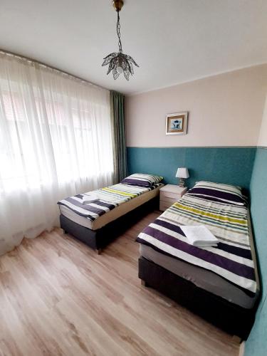 Postel nebo postele na pokoji v ubytování Villa Iris