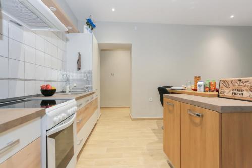 a kitchen with a stove and a counter top at Athens OwlCity in Athens