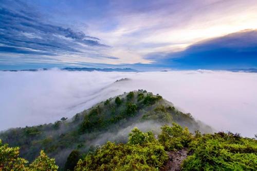 a hill in the middle of a field of clouds at Betong Merlin Hotel in Betong