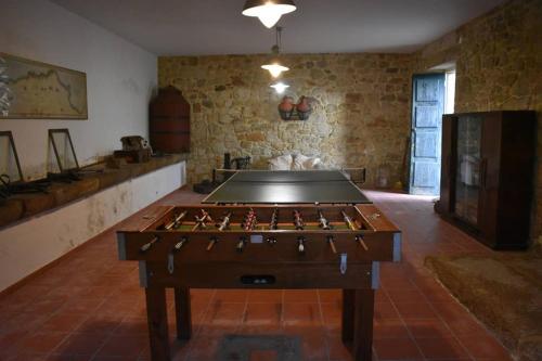 a room with a foosball table in a room at Casa do Lagar de Medelim in Medelim