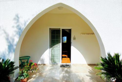 an arched entry way to a building with a door at Maria's Place in Polis Chrysochous
