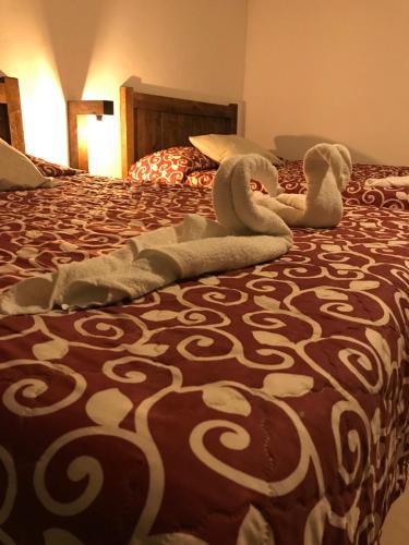 מיטה או מיטות בחדר ב-San Ángel Atlixco