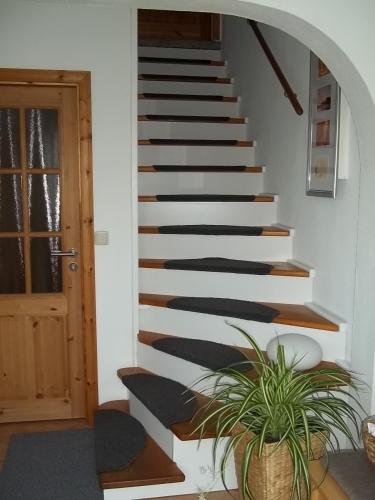 a staircase in a house with a potted plant at Apartment Wuhrt in Barsbek