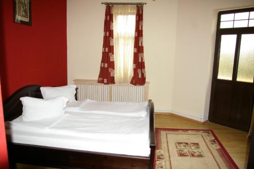 Cama o camas de una habitación en Pensiunea Onix